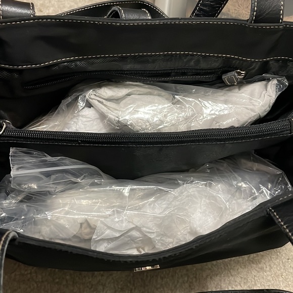 RLL on this lightly used bag, black material and black leather shoulder straps. - Picture 3 of 8